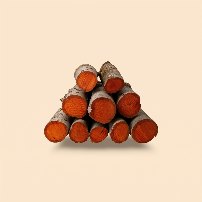 Split cherry firewood logs, reddish-brown heartwood, stacked on a cream studio background