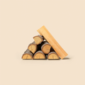Split hickory firewood logs with shaggy bark, stacked on a cream studio background