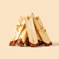Split pine firewood logs with knots and bark, stacked on a cream studio background