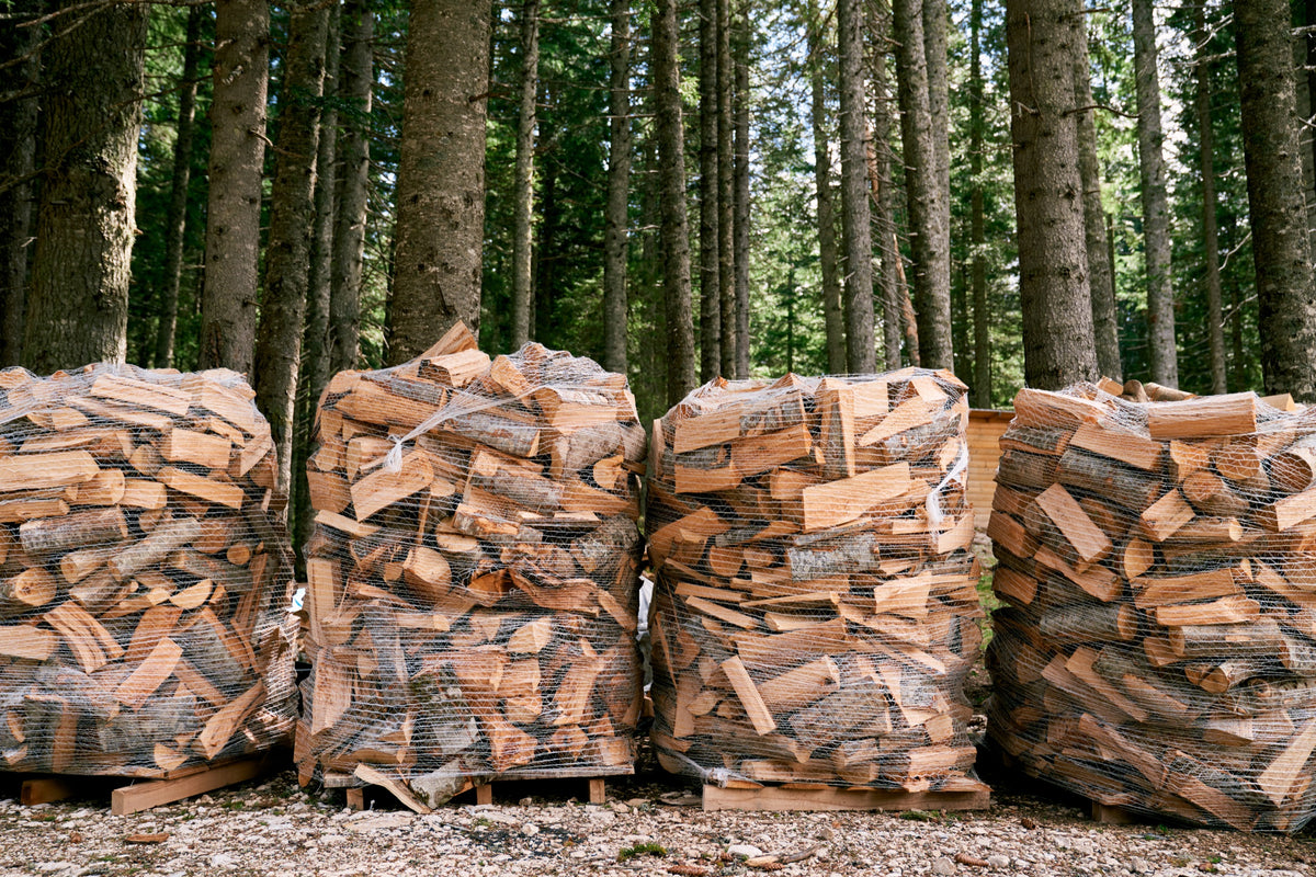 Pallet bags of firewood staged for freight delivery